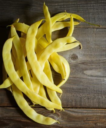 Yellow beans on old table