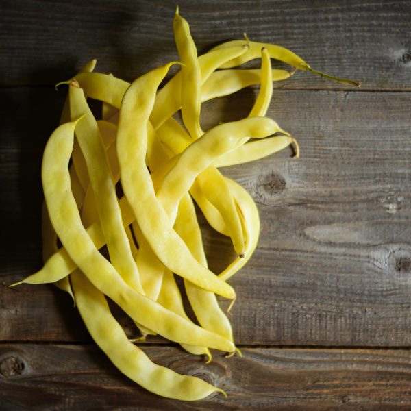 Yellow beans on old table